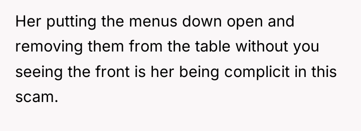 Her putting the menus down open and removing them from...