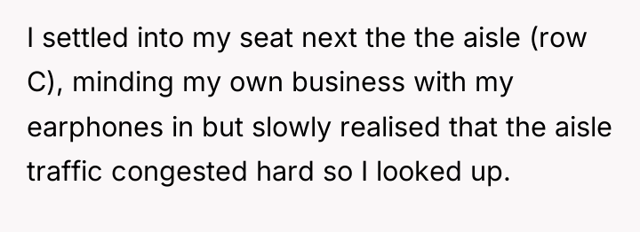 I settled into my seat next the the aisle (row...