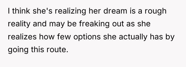 I think she's realizing her dream is a rough reality...