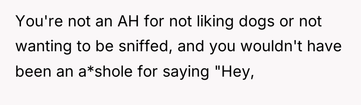 You're not an AH for not liking dogs or not...
