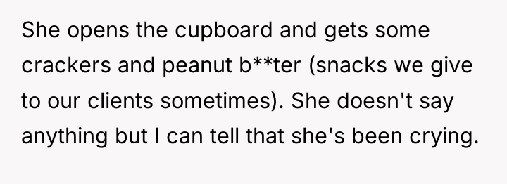 She opens the cupboard and gets some crackers and peanut...