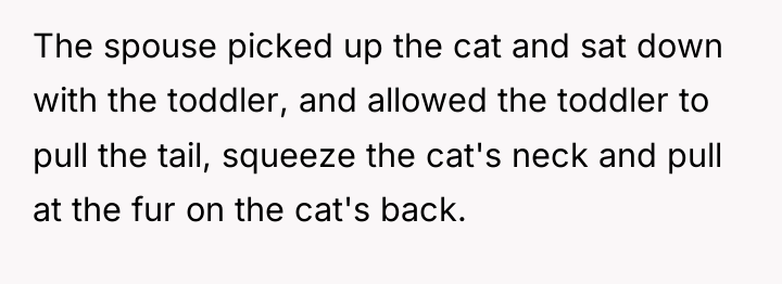 The spouse picked up the cat and sat down with...