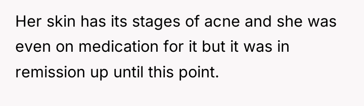 Her skin has its stages of acne and she was...