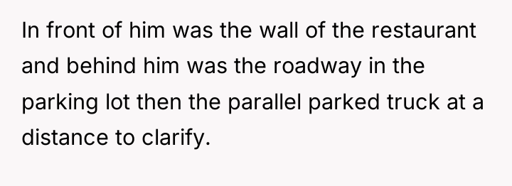 In front of him was the wall of the restaurant...