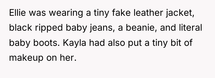 Ellie was wearing a tiny fake leather jacket, black ripped...