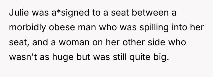 Julie was a*signed to a seat between a morbidly obese...
