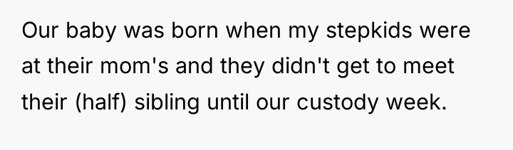 Our baby was born when my stepkids were at their...