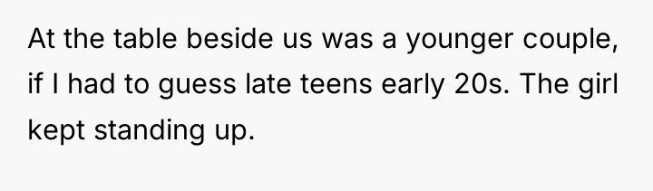 At the table beside us was a younger couple, if...