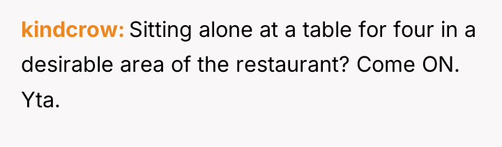 kindcrow Sitting alone at a table for four in a...