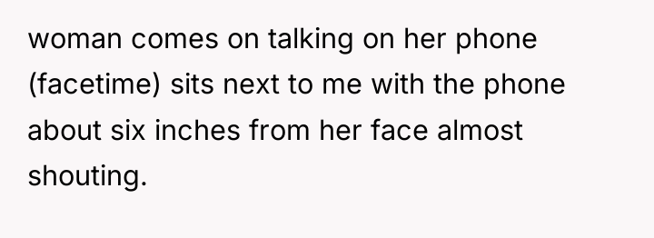 woman comes on talking on her phone (facetime) sits next...