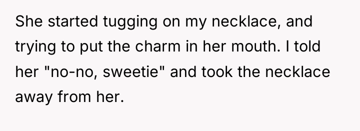 She started tugging on my necklace, and trying to put...