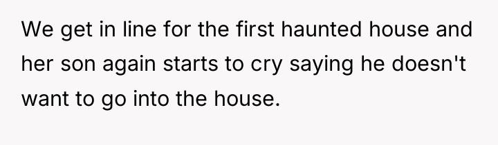 We get in line for the first haunted house and...