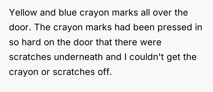 Yellow and blue crayon marks all over the door. The...