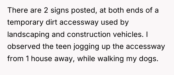 There are 2 signs posted, at both ends of a...