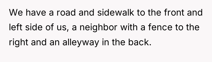 We have a road and sidewalk to the front and...