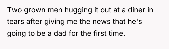 Two grown men hugging it out at a diner in...