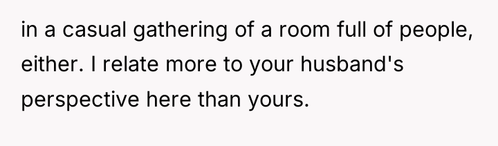 in a casual gathering of a room full of people,...