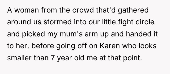 A woman from the crowd that'd gathered around us stormed...
