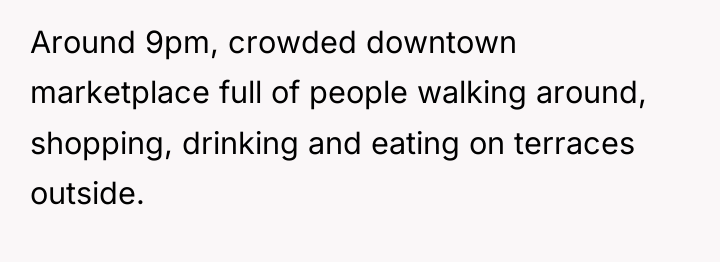 Around 9pm, crowded downtown marketplace full of people walking around,...