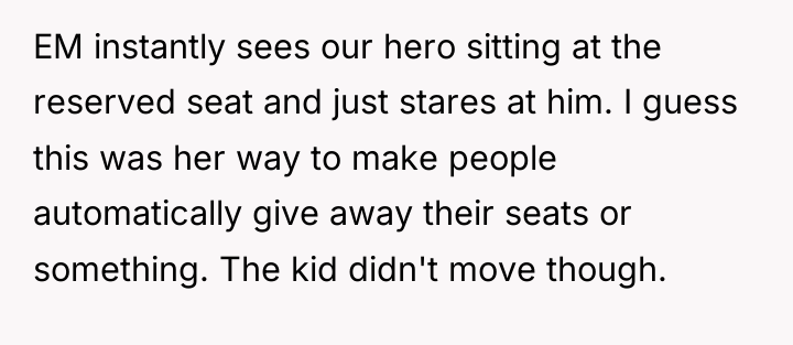 EM instantly sees our hero sitting at the reserved seat...