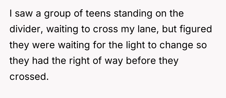 I saw a group of teens standing on the divider,...