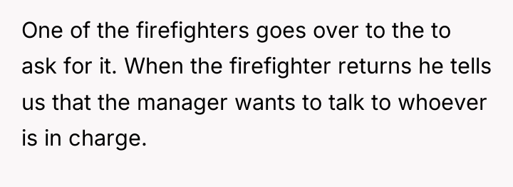 One of the firefighters goes over to the to ask...