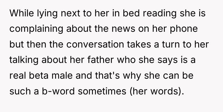 While lying next to her in bed reading she is...
