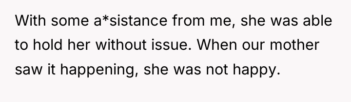 With some a*sistance from me, she was able to hold...