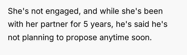 She's not engaged, and while she's been with her partner...