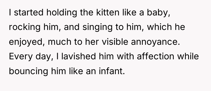 I started holding the kitten like a baby, rocking him,...