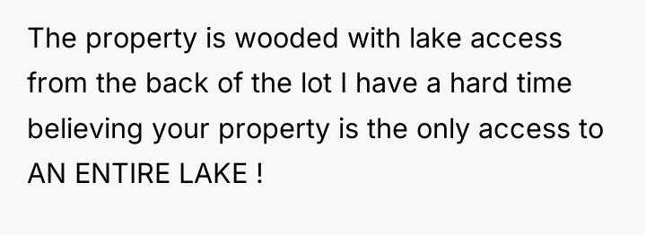 The property is wooded with lake access from the back...