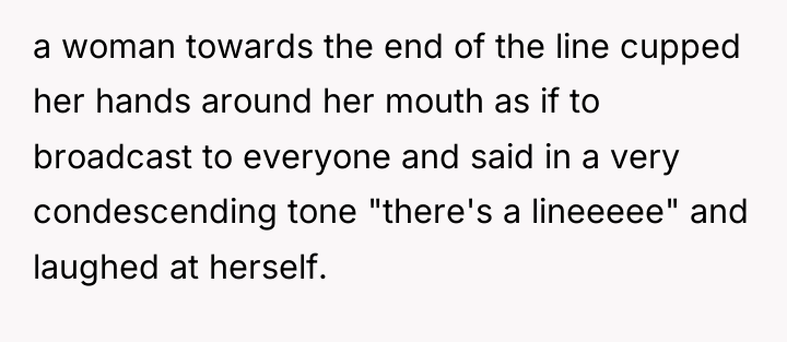 a woman towards the end of the line cupped her...