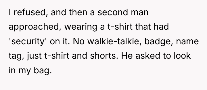 I refused, and then a second man approached, wearing a...