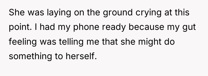 She was laying on the ground crying at this point....