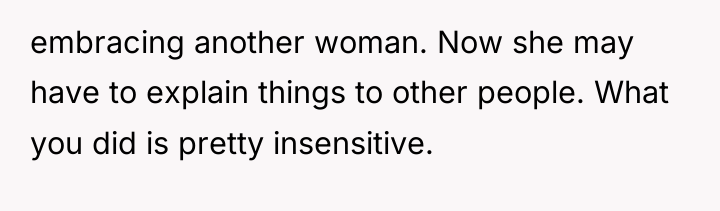 embracing another woman. Now she may have to explain things...