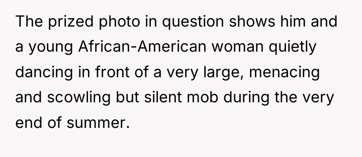 The prized photo in question shows him and a young...