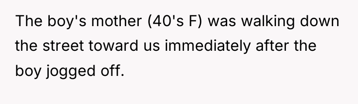 The boy's mother (40's F) was walking down the street...