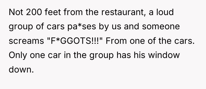 Not 200 feet from the restaurant, a loud group of...